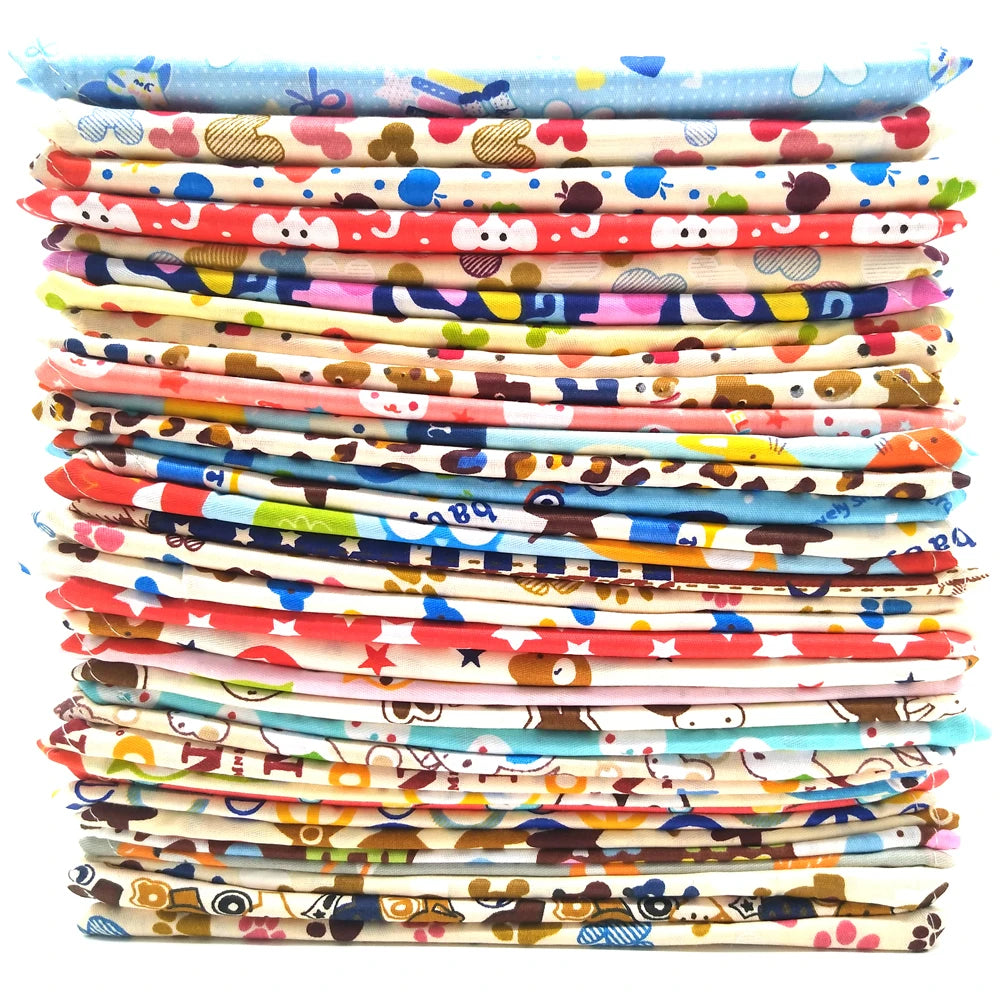 Stack of colorful fabric pieces with various patterns on a white background