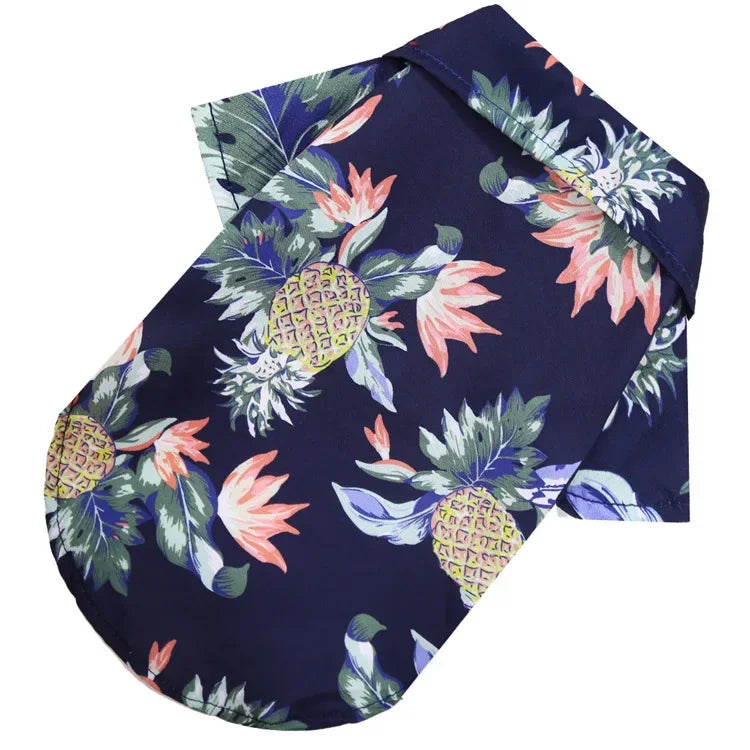 Navy blue fabric with pineapple and floral pattern on a white background
