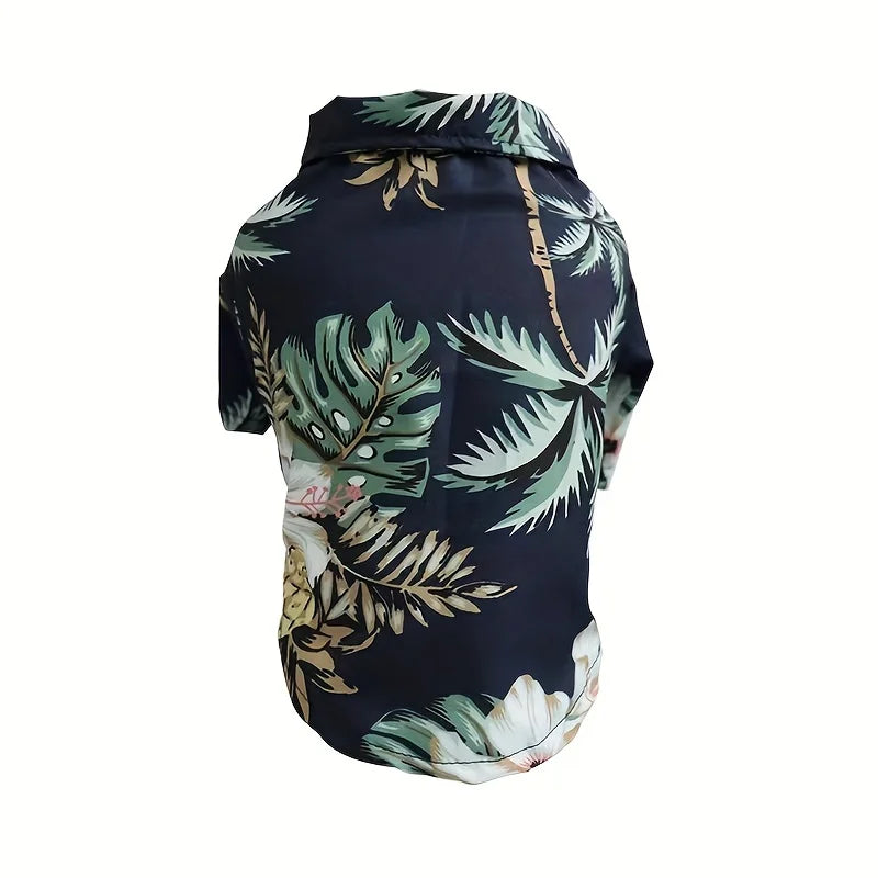 Navy blue dog hoodie with tropical leaf pattern on a white background