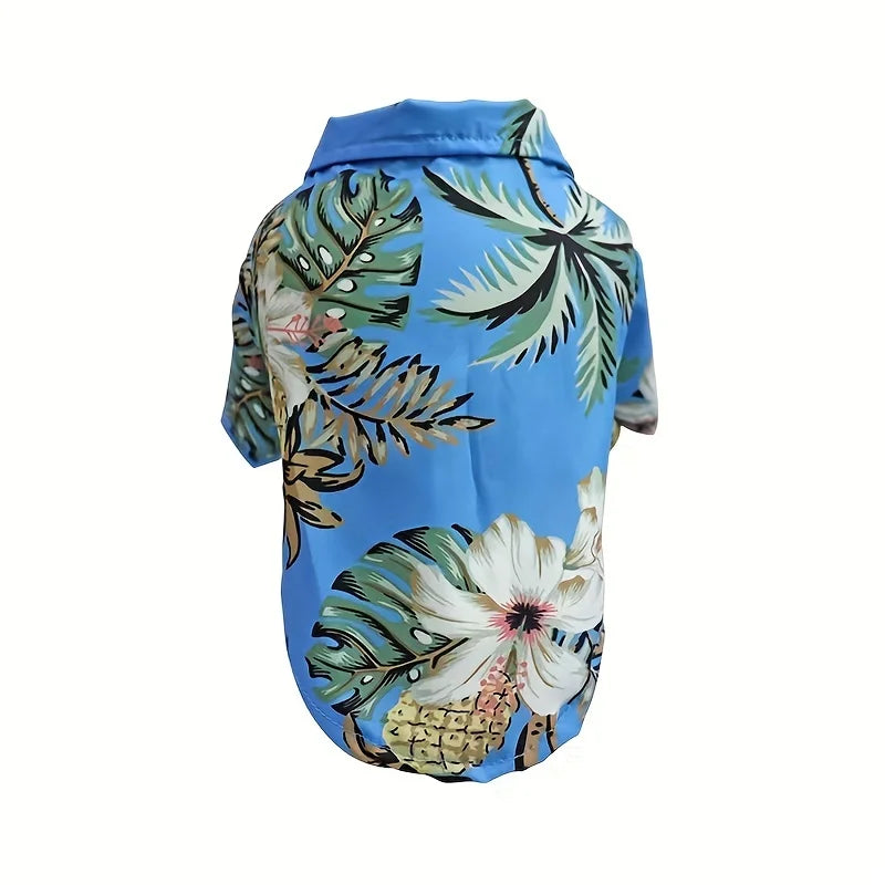 Blue pet coat with tropical leaf pattern on a white background