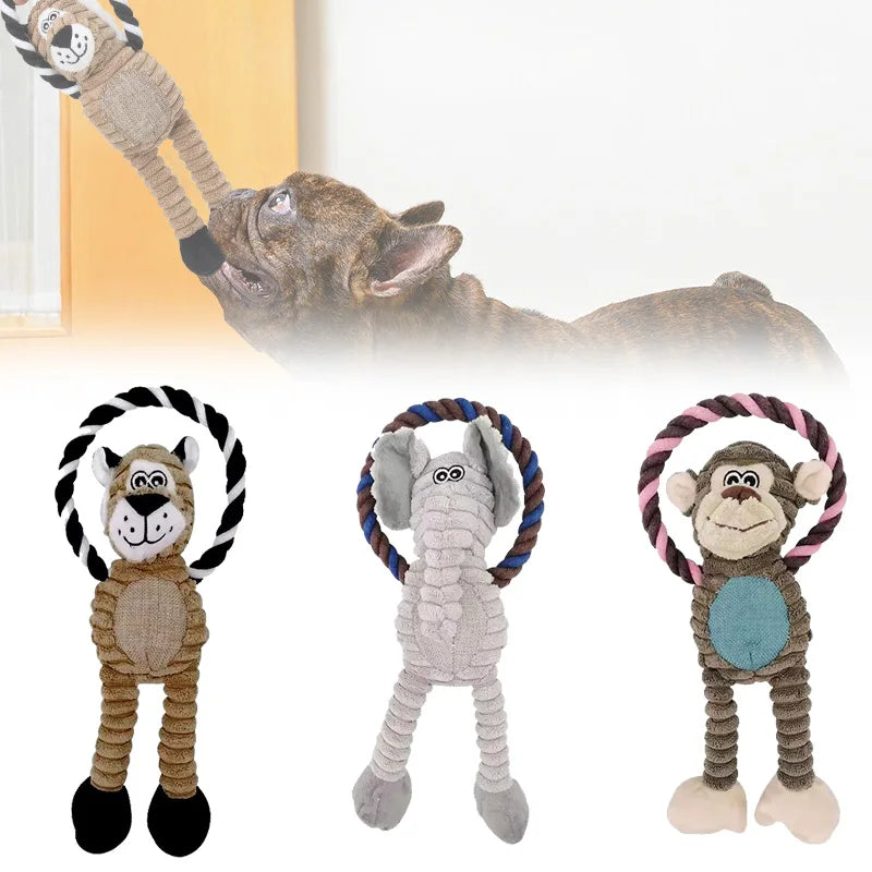 Dog toys shaped like a zebra, elephant, and monkey with rattles, with a dog biting at one of them.