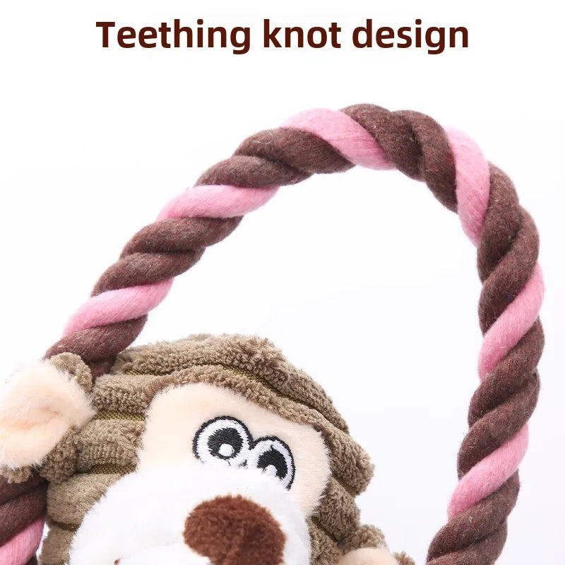 Dog toy with monkey design and pink and brown rope on a white background
