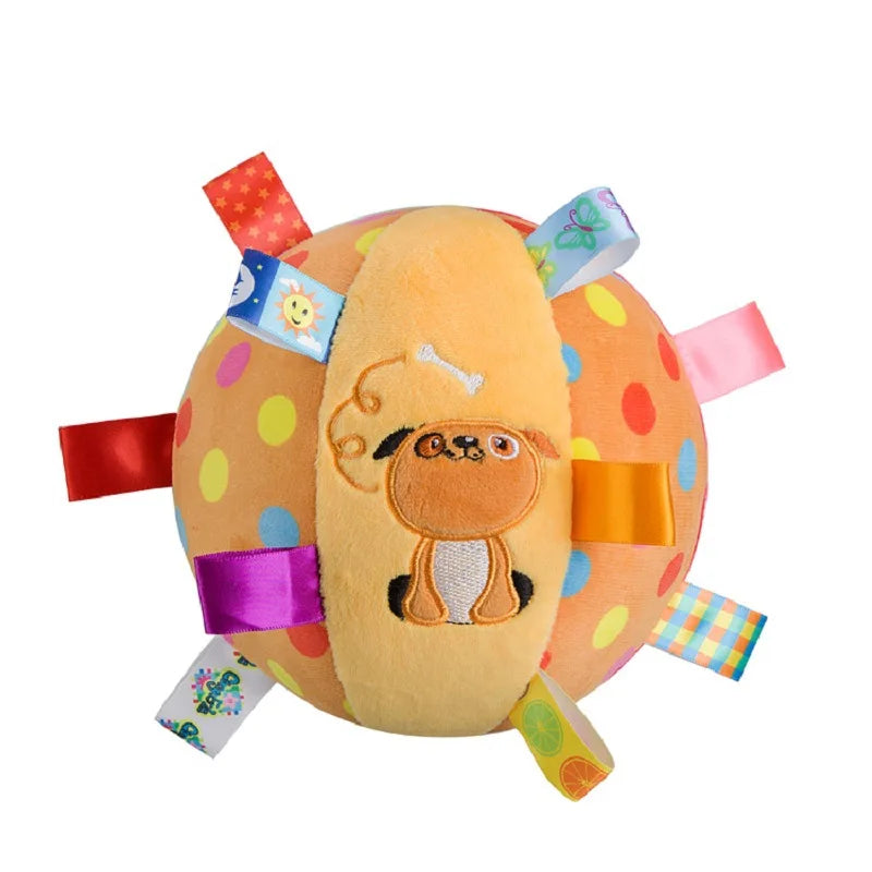Colorful plush ball with cartoon dog face and various tags on a white background