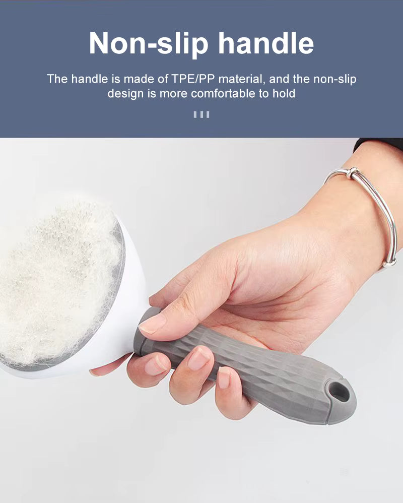 Hand holding a cleaning brush with a non-slip handle on a white background